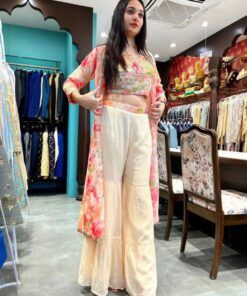 Party Wear Style Cotton Cream Printed Sharara Suit With Pink Shrug